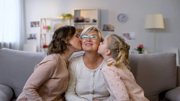 Young Female Kid Kissing Grandmother Cheeks Hugging Together Family Love — Stock Photo, Image