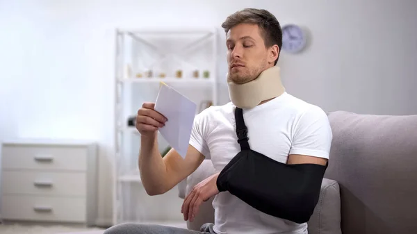 Injured Man Foam Cervical Collar Arm Sling Trying Open Envelope — Stock Photo, Image