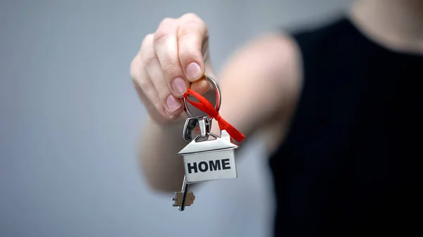 Woman Holding Keychain Word Home Long Awaited House Purchase Closeup — Stock Photo, Image