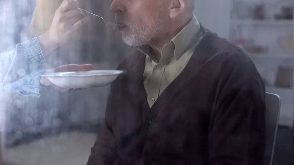 Granddaughter Feeding Old Man Oatmeal Family Support Care Volunteering — Stock Photo, Image