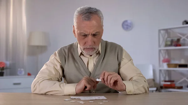 Senior Male Trying Collect Puzzle Memory Problems Cognitive Impairment — Stock Photo, Image