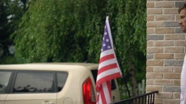 American patriot enjoying beautiful view on terrace, resting at weekend cottage — Stock Video