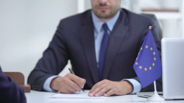 Politician of European Union signing sanction termination, congratulates partner — Stock Video