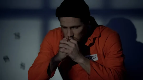 European Imprisoned Male Holding Silver Cross Praying Cell Feeling Guilty — Stock Photo, Image