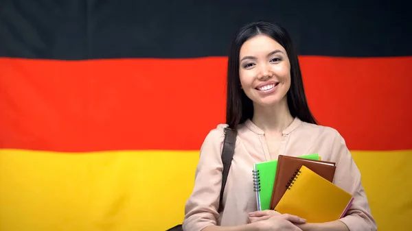 Happy Female Student Holding Copybooks German Flag Background Education — Stock Photo, Image