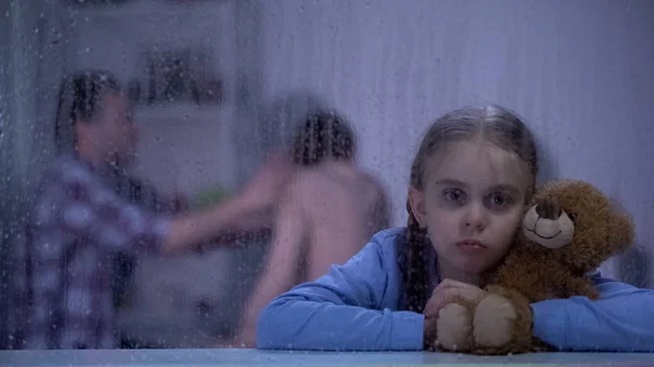 Frightened Girl Hugging Teddy Bear Rainy Day Listening Parents Quarrel — Stock Photo, Image