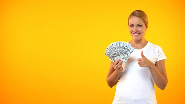 Pretty Smiling Woman Showing Thumbs Holding Dollars Cashback Service Credit — Stock Photo, Image