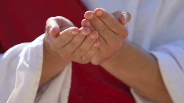 Male arms in robe holding symbol heart with cross, religious hospitals, charity — Stock Video