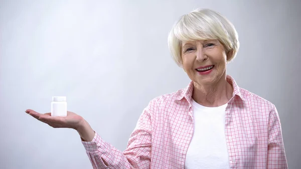 Positive Old Woman Proposing Pills Jar Vitamins Health Support Treatment — Stock Photo, Image