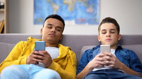 Bored Multiracial Male Teens Surfing Social Network Replacing Live Communication — Stock Photo, Image