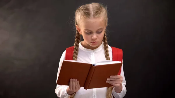 Smart Female Kid Reading Book Blackboard Background Thirst Knowledge — Stock Photo, Image