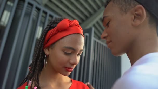 Beautiful afro-american teen couple attempting to kiss, romantic feelings — Stock Video