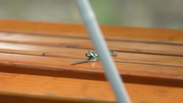 Man with visual impairment taking keys from bench where he was sitting, close-up — Stock Video