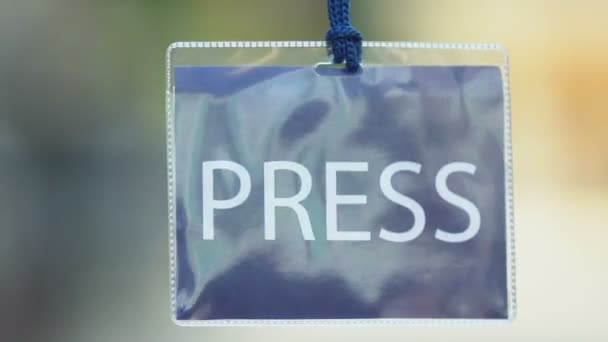 Blue press card, journalist authorization pass, mass media privilege, event — Stock video