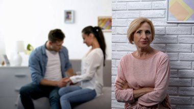 Jealousy, dissatisfied mother-in-law watching young couple flirting at home clipart