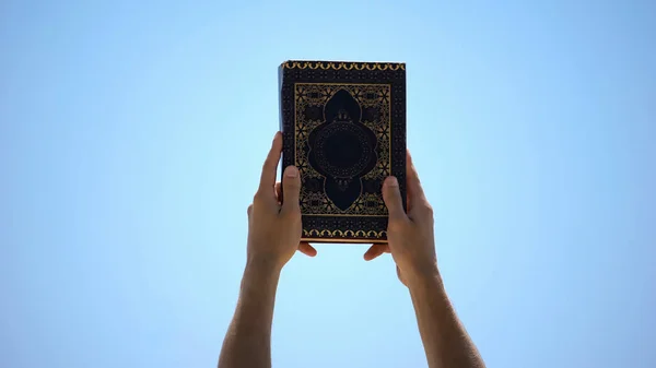 Male Hands Raising Koran Sky Sharing Sacramental Islamic Teachings Faith — Stock Photo, Image