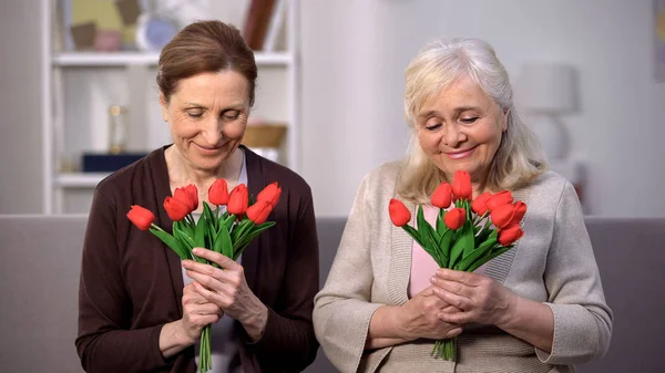 Smiling Elderly Women Holding Bouquets Tulips Happy Mothers Day Present — Stockfoto