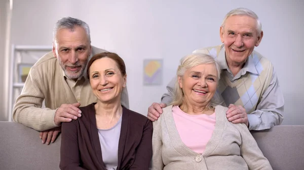 Senior Couples Hugging Smiling Camera Family Portrait Togetherness — Stock Photo, Image