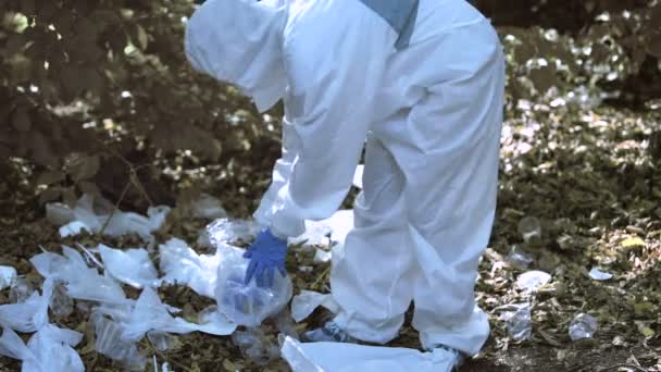 Eco volunteer taking out earth planet from plastic bag, world environment day — Stock Video