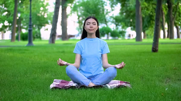 Attractive Young Lady Meditating Park Sitting Lotus Pose Relaxing Outdoors — Stock Photo, Image