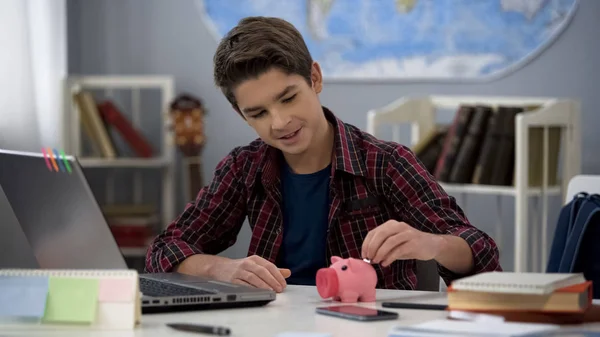 Male Kid Putting Coin Piggy Bank Properly Saving Pocket Money — Stock Photo, Image