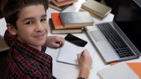 Male Pupil Smiling Camera Doing Homework Sitting Table Gifted Child — Stock Photo, Image