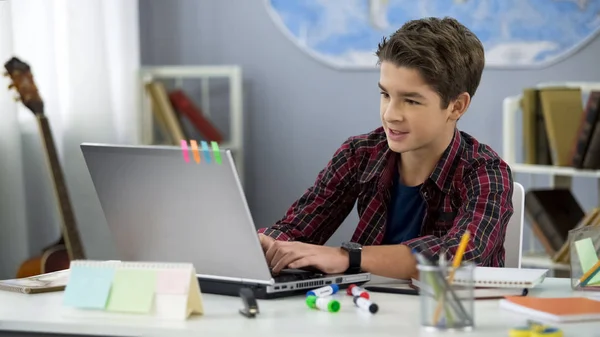 Schoolboy Playing Online Game Laptop Home Sitting Table Teenage Free — Stock Photo, Image