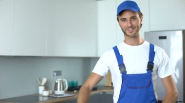 Professional handyworker showing thumbs up, ad of high-quality home repairs