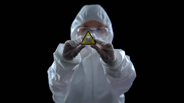 Scientist Protective Suit Holding Poison Symbol Hands Black Background — Stock Photo, Image