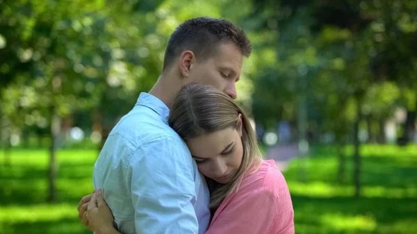 Man Hugging Comforting Upset Girlfriend Park Togetherness Support — Stock Photo, Image