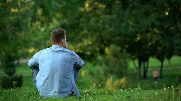 Young Man Sitting Grass Park Enjoying Weekend Free Time Loneliness — Stock Photo, Image