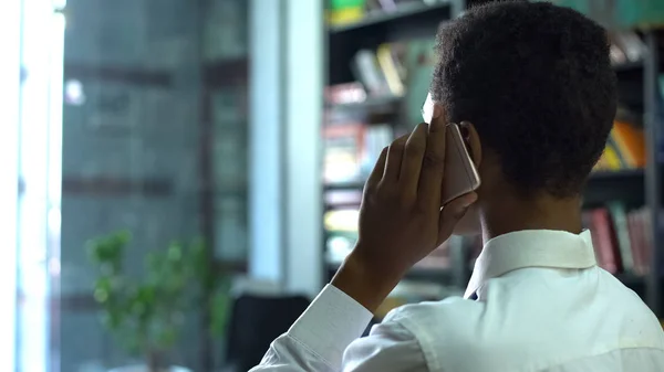 Busy African American Male Student Talking Smartphone Discussing School Project — Stock Photo, Image