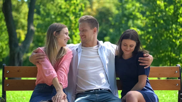 Handsome Man Resting Bench Park Hugging Two Attractive Females Ladies Stock Image