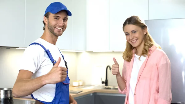 Plumber and happy client showing thumbs up, ad of quality home repair services