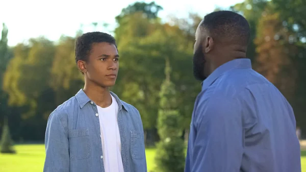 Afro American Dad Scolding Teenage Son Outdoors Family Conflict Communication — Stock Photo, Image