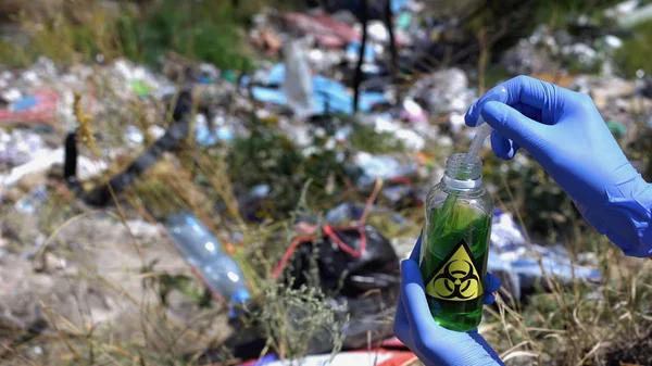 Hand Glove Taking Sample Bottle Biohazard Sign Landfill — Stock Photo, Image
