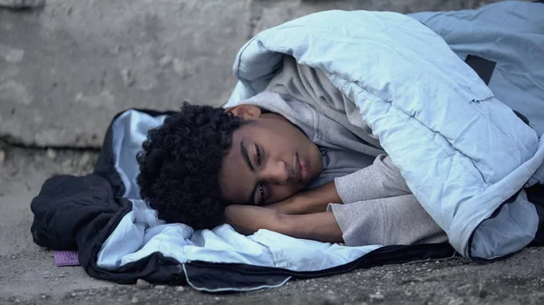 Homeless African Teenager Lying Sleeping Bag Ground Poverty Unemployment — ストック写真