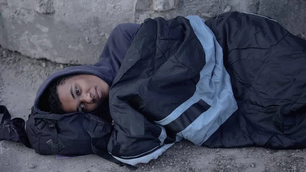 Desperate Black Man Lying Street Covered Sleeping Bag Poverty Hopelessness — Stock Photo, Image