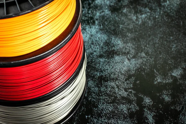 Filament for 3d printing. Bright thermoplastic of neon orange, color. Reel horizontal view. — Stock Photo, Image