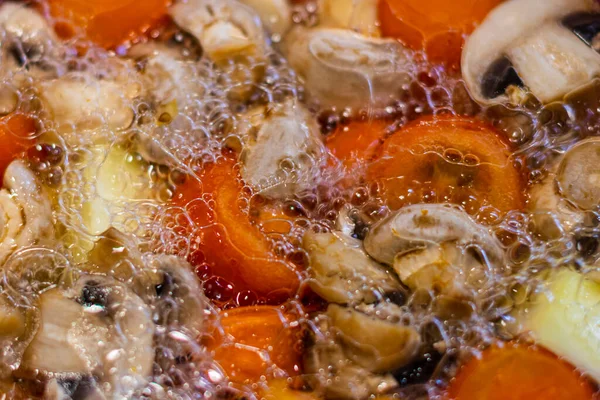 Vegetable Ragout. Cooking stewed vegetables with mushrooms. Boiling vegetables with mushrooms. Top viev. — Stock Photo, Image