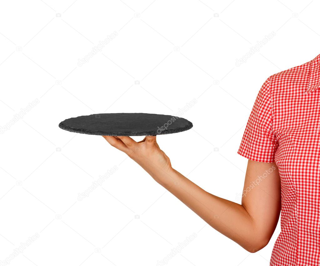 empty black slate round stone in the hands of a waiter for your dish. perspective view Template for your design. isolated on white background.