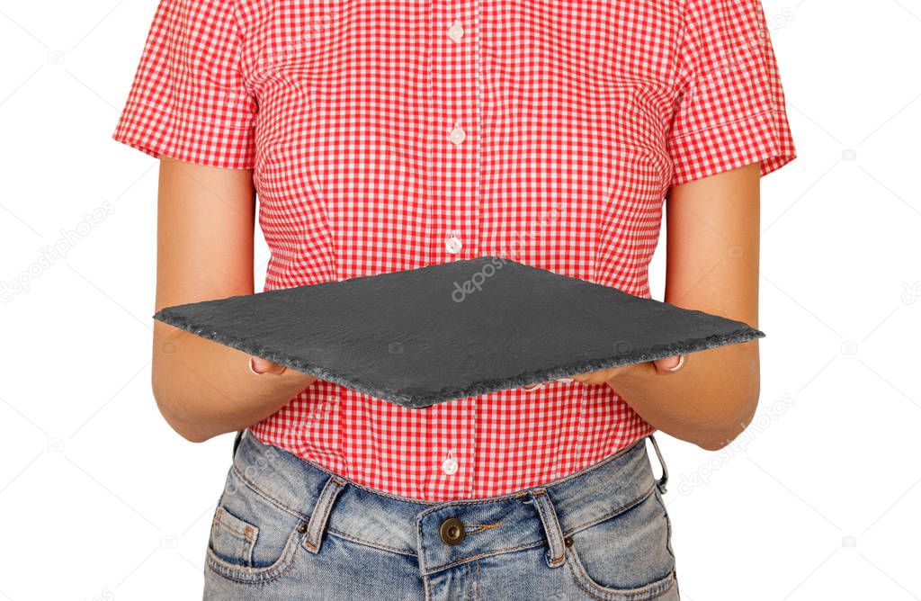 woman dressed in shirt holding a square slate platter or a board in front of her. perspective view Template for your design. isolated on white background.