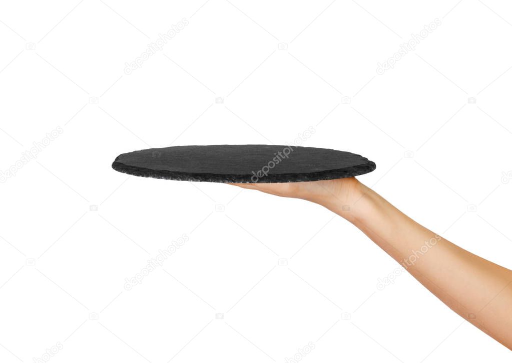 empty black slate round stone in the hand. perspective view Template for your design. isolated on white background.