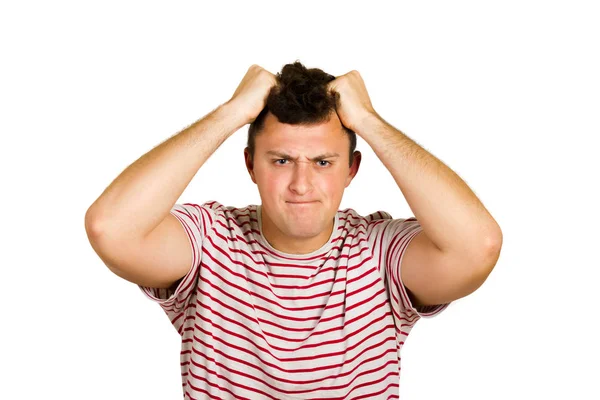 üzgün genç adam ezik poz. duygusal adam beyaz arka plan üzerinde izole.