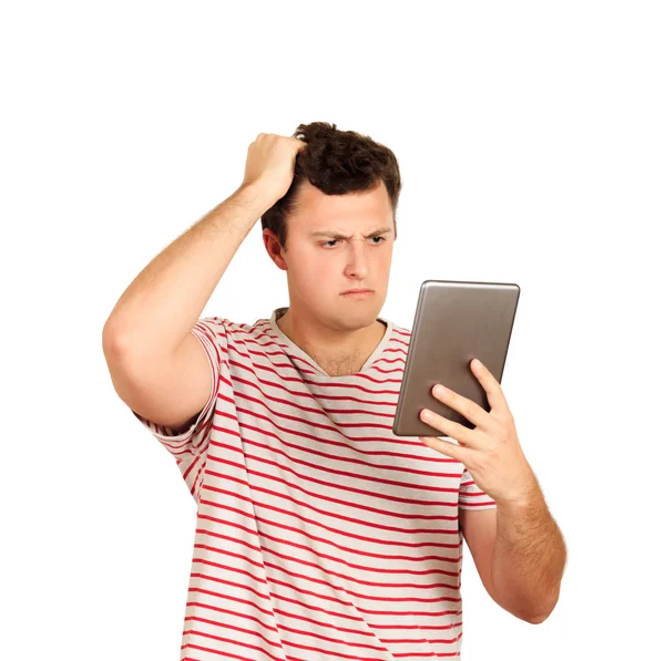 Thinking Guy Looks Tablet Scratches His Head His Hand Emotional — Stock Photo, Image