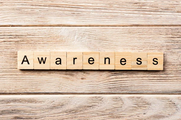 awareness word written on wood block. awareness text on table, concept.