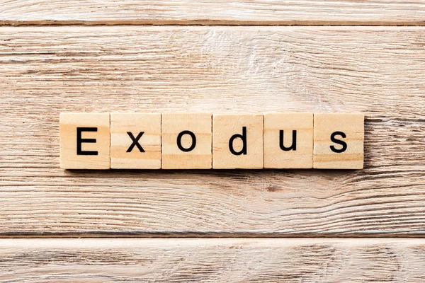 Słowo Exodus Napisane Drewnianym Bloku Tekst Exodus Stole Koncepcja — Zdjęcie stockowe