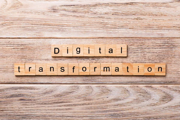 digital transformation word written on wood block. digital transformation text on wooden table for your desing, concept.