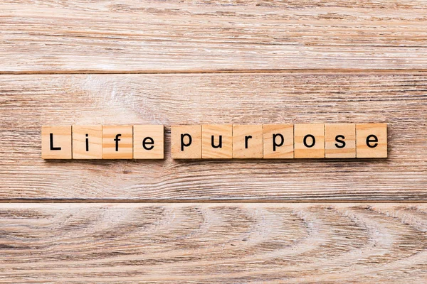 life purpose word written on wood block. life purpose text on wooden table for your desing, concept.