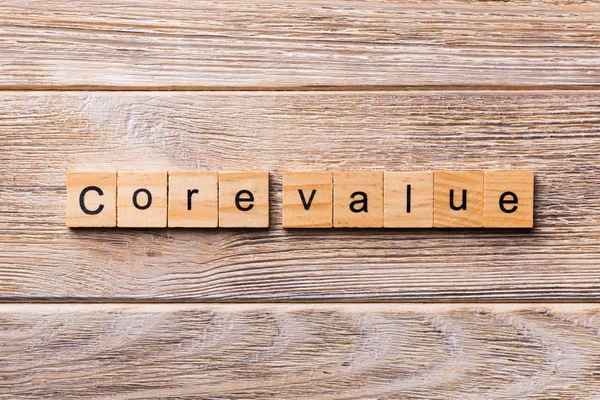 CORE VALUE word written on wood block. CORE VALUES text on wooden table for your desing, concept.